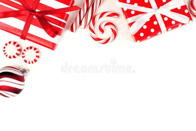 Beira de canto do Natal de presentes e de doces vermelhos e brancos