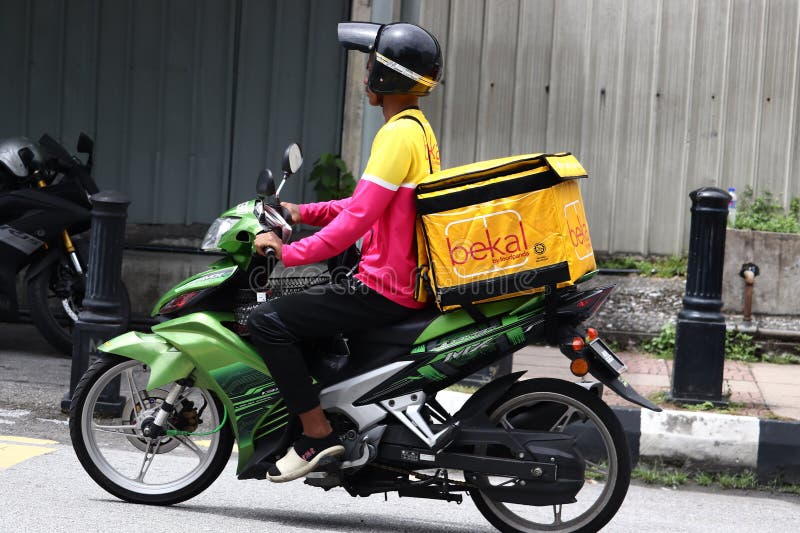 The delivery rider from "bekal by foodpanda" out on the street in Malaysia. bekal is an end-to-end halal-certified, by Jakim, food delivery service in Malaysia. The delivery rider from "bekal by foodpanda" out on the street in Malaysia. bekal is an end-to-end halal-certified, by Jakim, food delivery service in Malaysia