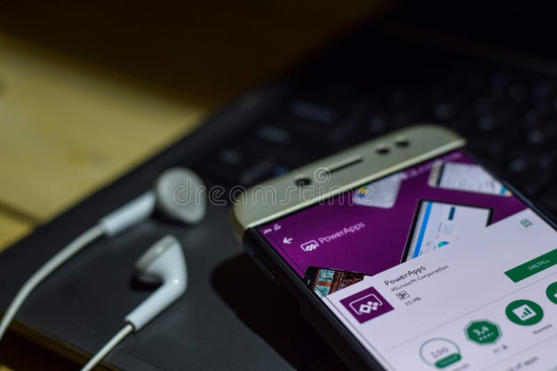 PowerApps dev application on Smartphone screen. stock photos