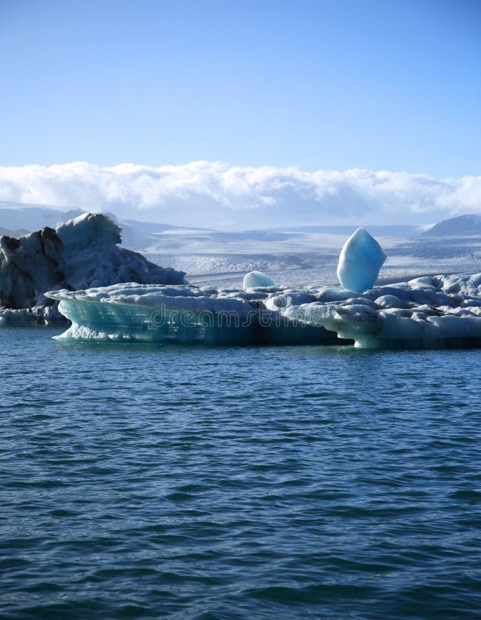 Icebery precariously balanced Jokulsarlon lagoon Iceland. Icebery precariously balanced Jokulsarlon lagoon Iceland