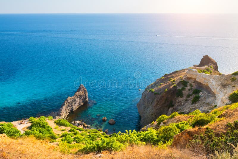 Beautiful sea coast with turquoise water and rocks in Fiolent Cape, Crimea. Summer seascape, famous travel destination. Beautiful sea coast with turquoise water and rocks in Fiolent Cape, Crimea. Summer seascape, famous travel destination