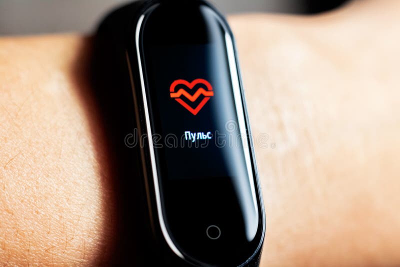 BELARUS, MINSK - OCTOBER 31, 2019: Xiaomi Mi Band 4 on Hand Shows Pulse  Editorial Stock Image - Image of interface, electronic: 162858504