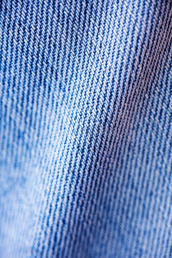 Belas artes macro extremas do fundo das fibras da roupa de cal?as de ganga nos produtos de alta qualidade 50,6 Megapixels das c?p foto de stock royalty free Belas artes macro extremas do fundo das fibras da roupa de cal?as de ganga nos produtos de alta qualidade 50,6 Megapixels das c?p foto de stock royalty free