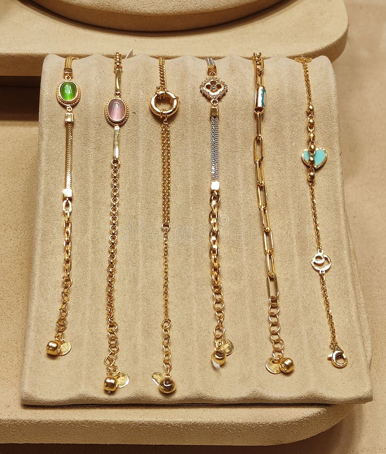 Beautiful women's gold bracelets with decorative designs on the jewelry store a window. Beautiful women's gold bracelets with decorative designs on the jewelry store a window