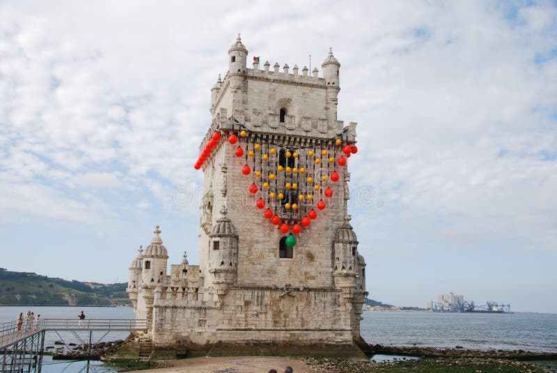 Image of the tower of Belem, a famous monument of Lisbon, with traditional red decoration. The monument is protected by the UNESCO. Photo taken on: June 15th, 2008. Image of the tower of Belem, a famous monument of Lisbon, with traditional red decoration. The monument is protected by the UNESCO. Photo taken on: June 15th, 2008