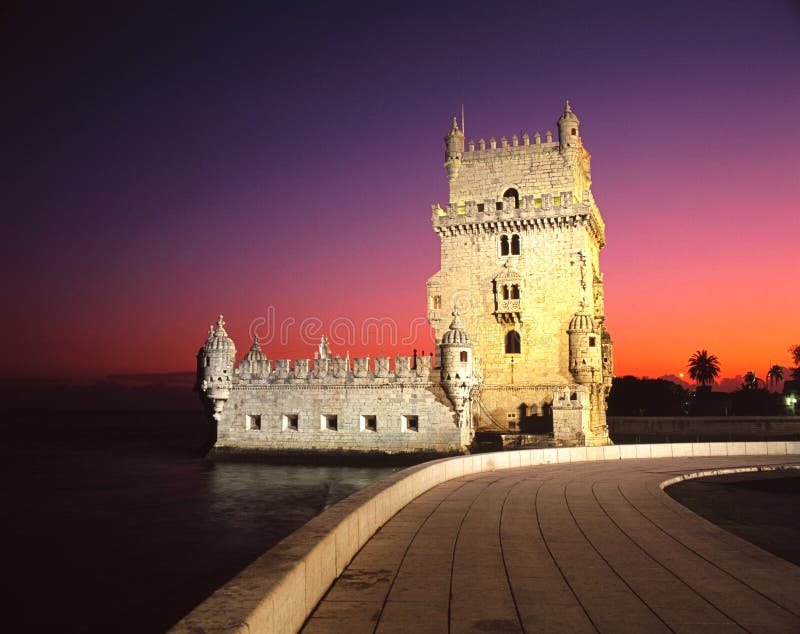 Tower of Belem against an orange and mauve sunset, Lisbon, Portugal, Western Europe. Tower of Belem against an orange and mauve sunset, Lisbon, Portugal, Western Europe.