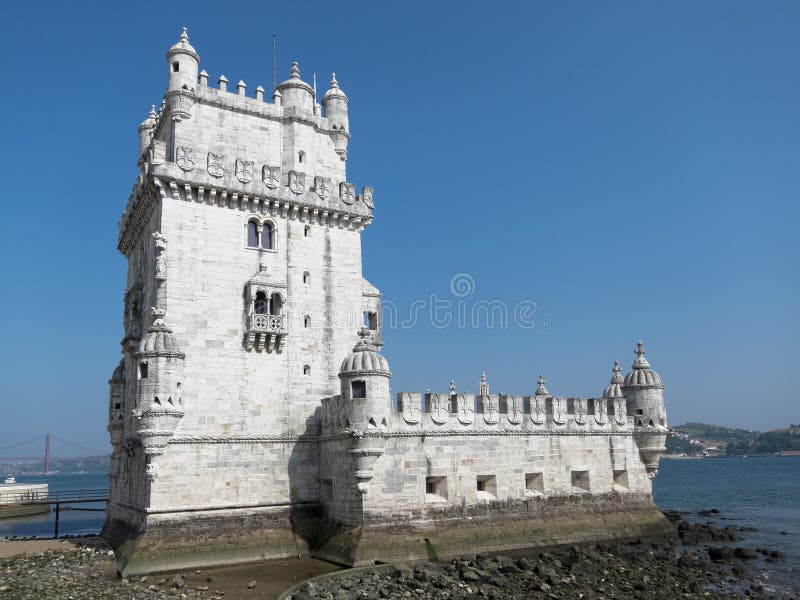 The fortified 16th century Belem Tower (Torre de Belem) on the banks of Tagus river in Lisbon, Portugal. The fortified 16th century Belem Tower (Torre de Belem) on the banks of Tagus river in Lisbon, Portugal.