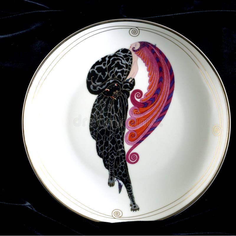 Erte art deco collectible plate on black velvet background the Beauty and the Beast showing a woman with a flowing headdress or head dress and coat of furs in a symmetrical design. Erte art deco collectible plate on black velvet background the Beauty and the Beast showing a woman with a flowing headdress or head dress and coat of furs in a symmetrical design