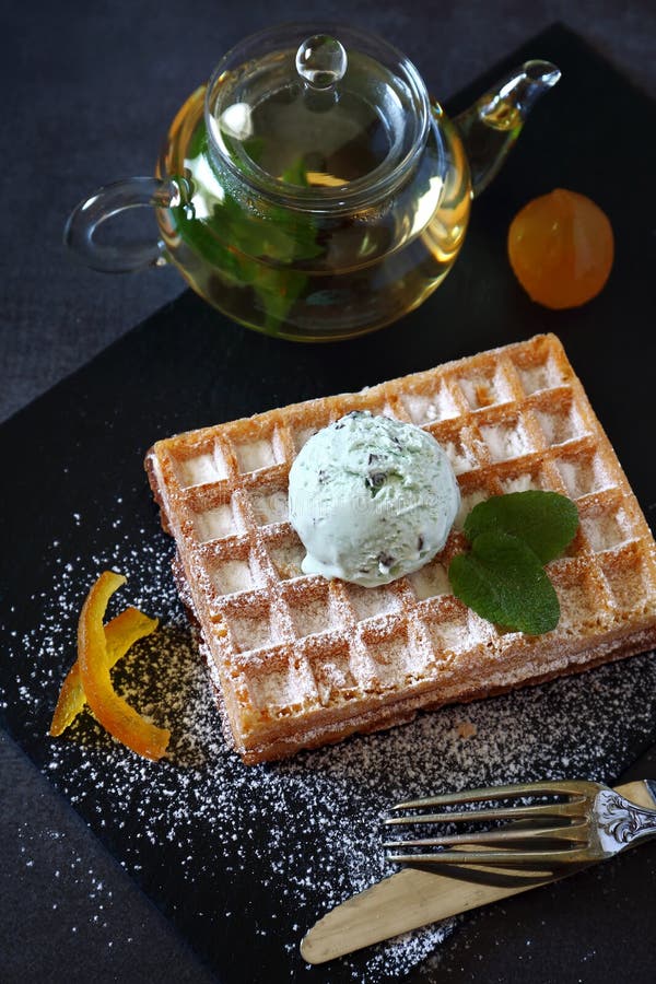 Belgian Waffles with Mint Chocolate Chip Ice Cream and Mint Tea Stock