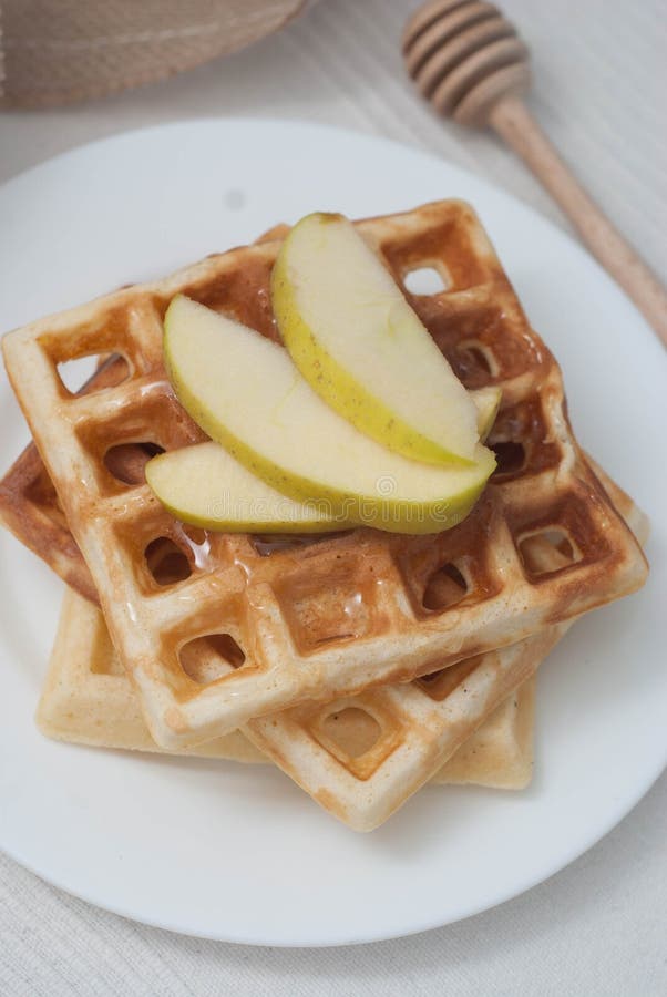 Belgium Waffles with Apples and cinnamon and honney. Close up Breakfast. homemade Food. Vertical Image.