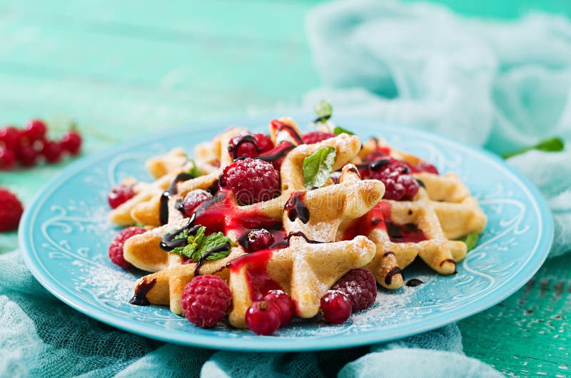 Belgium waffles with raspberries and syrup royalty free stock image Belgium waffles with raspberries and syrup royalty free stock image