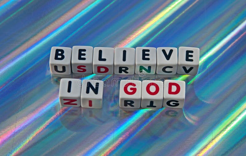 Text ' believe ' and ' god ' inscribed in uppercase letters on small white cubes, colorful background. Text ' believe ' and ' god ' inscribed in uppercase letters on small white cubes, colorful background.