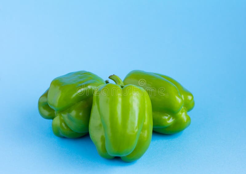 Green Pepper on Scales on Blue Background Stock Image Image of