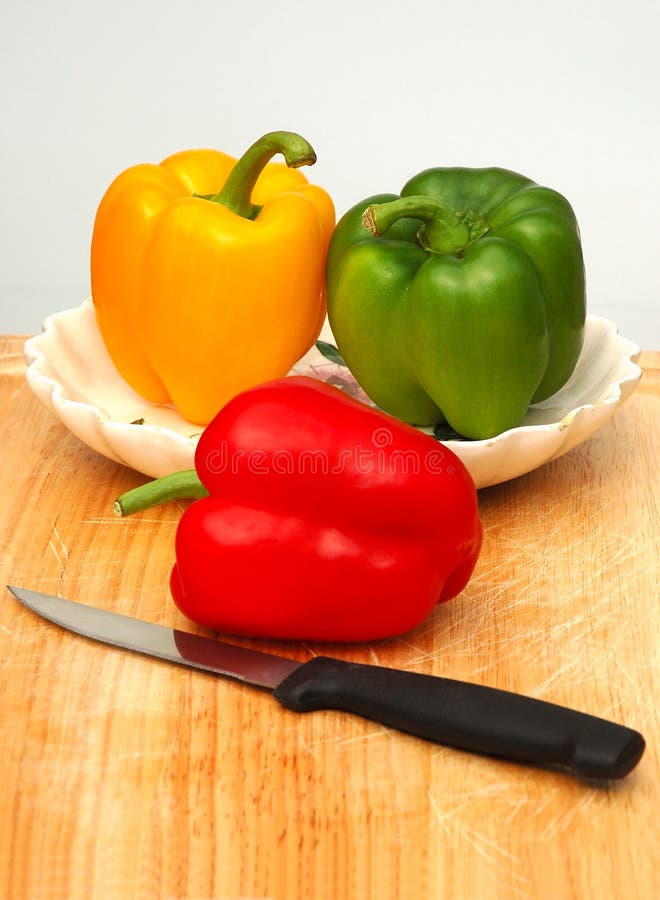 Bell peppers on chopping board