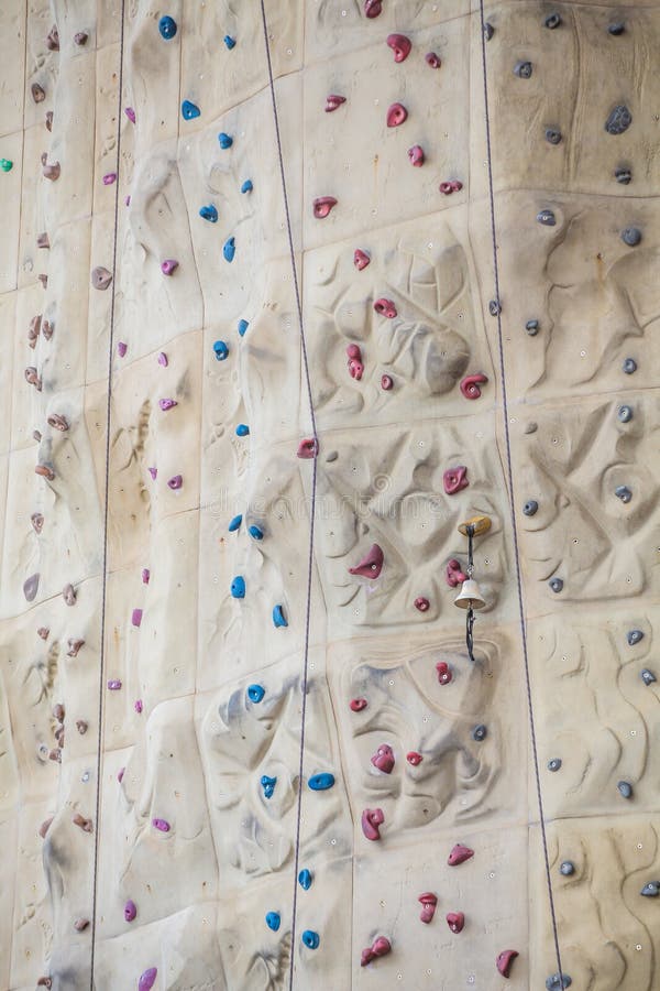 Bell on Rock Climbing Wall stock image. Image of colors 42437927