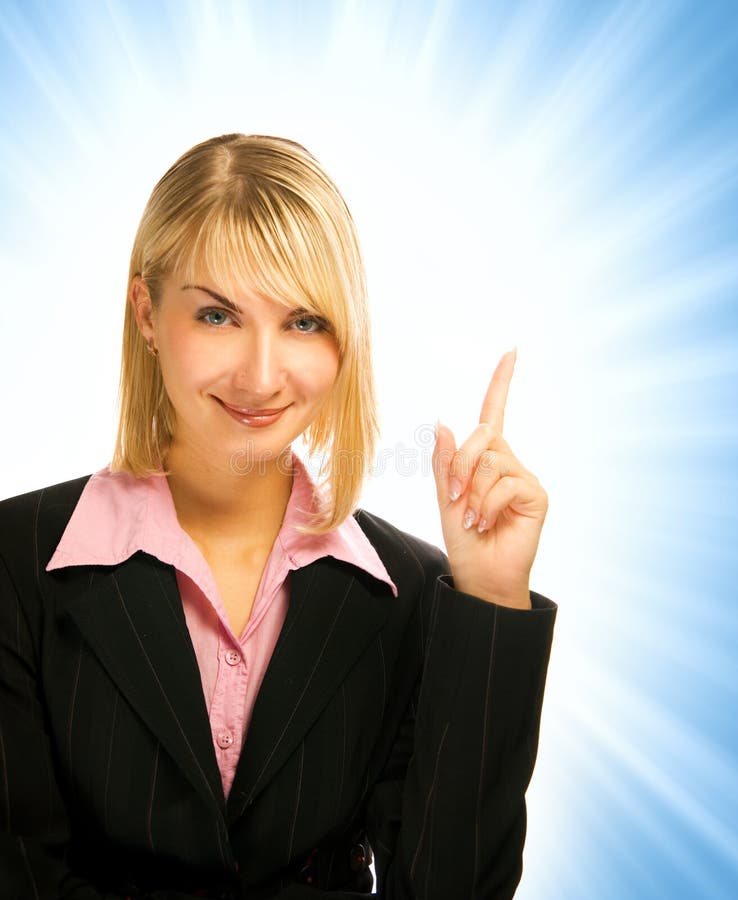 Beautiful business woman pointing her finger on abstract background. Beautiful business woman pointing her finger on abstract background