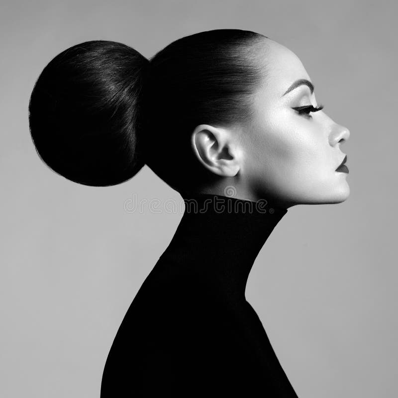 Black and white fashion art studio portrait of beautiful elegant woman in black turtleneck. Hair is collected in high beam. Elegant ballet style. Black and white fashion art studio portrait of beautiful elegant woman in black turtleneck. Hair is collected in high beam. Elegant ballet style