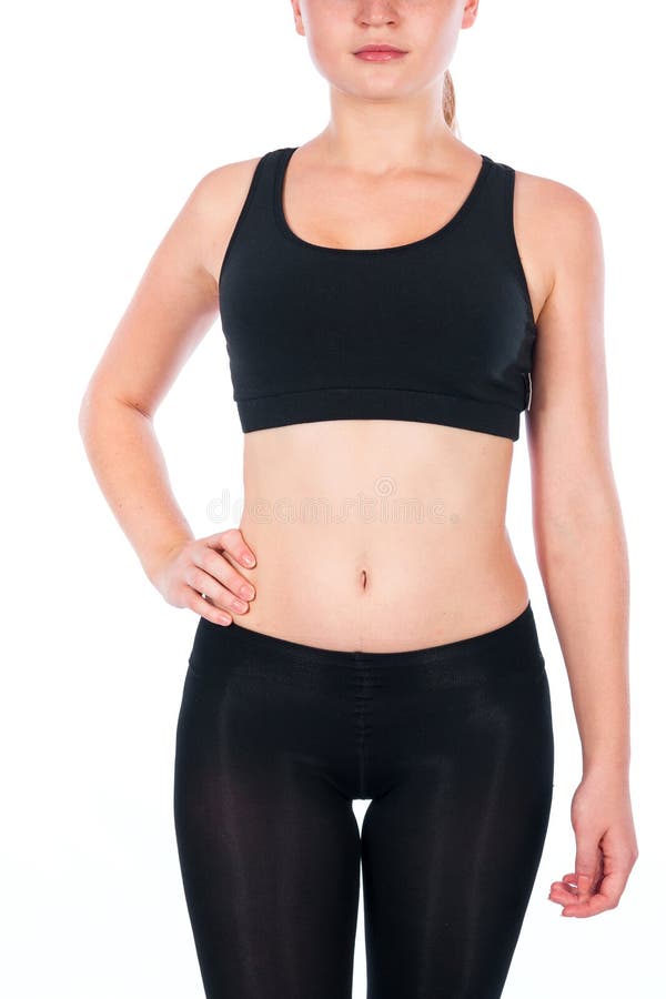 Bella giovane donna bionda Una giovane donna atletica in un vestito di sport immagini stock libere da diritti Bella giovane donna bionda Una giovane donna atletica in un vestito di sport immagini stock libere da diritti