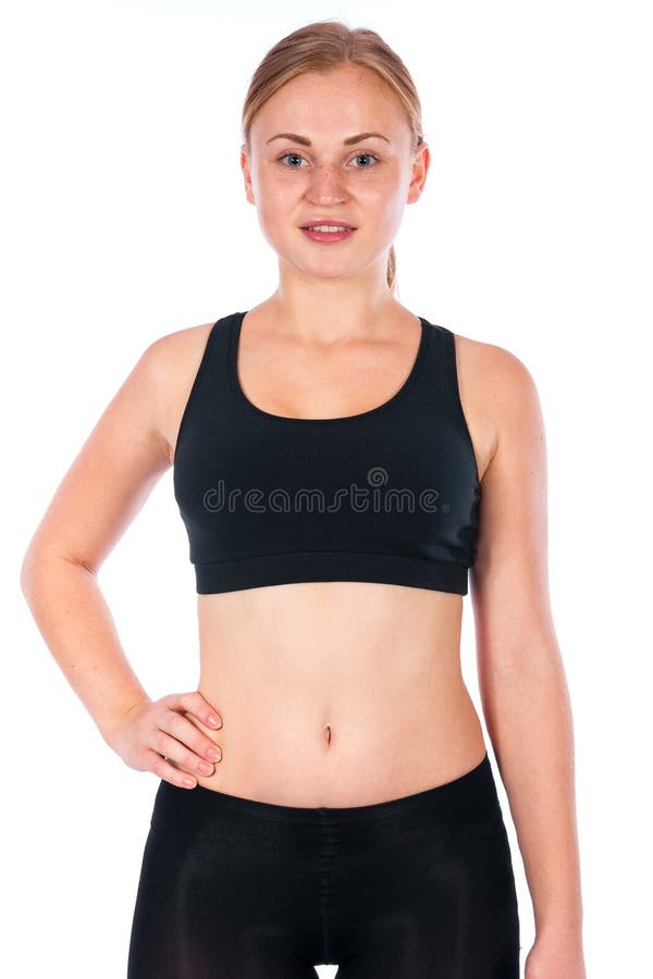 Bella giovane donna bionda Una giovane donna atletica in un vestito di sport immagini stock Bella giovane donna bionda Una giovane donna atletica in un vestito di sport immagini stock