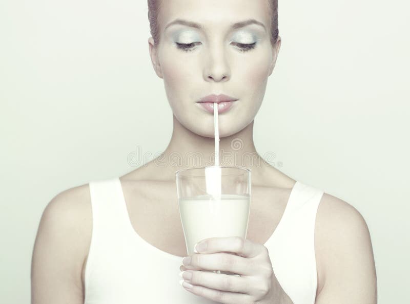 Fashion portrait of beautiful girl with glass of milk. Fashion portrait of beautiful girl with glass of milk