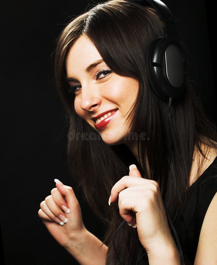 Bella ragazza delle cuffie immagini stock Bella ragazza delle cuffie immagini stock