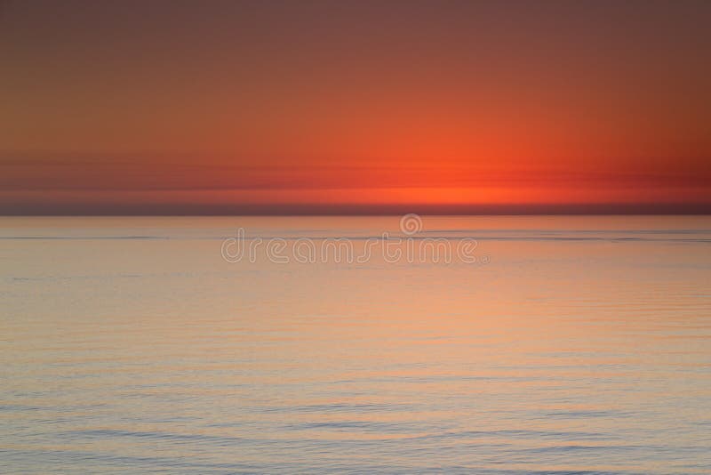 Bella vista di oceano dopo il tramonto lungo la spiaggia Florida di Clearwater fotografia stock libera da diritti Bella vista di oceano dopo il tramonto lungo la spiaggia Florida di Clearwater fotografia stock libera da diritti