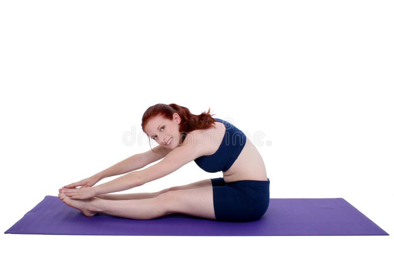 Belle adolescente expliquant le bout droit de yoga photos stock Belle adolescente expliquant le bout droit de yoga photos stock