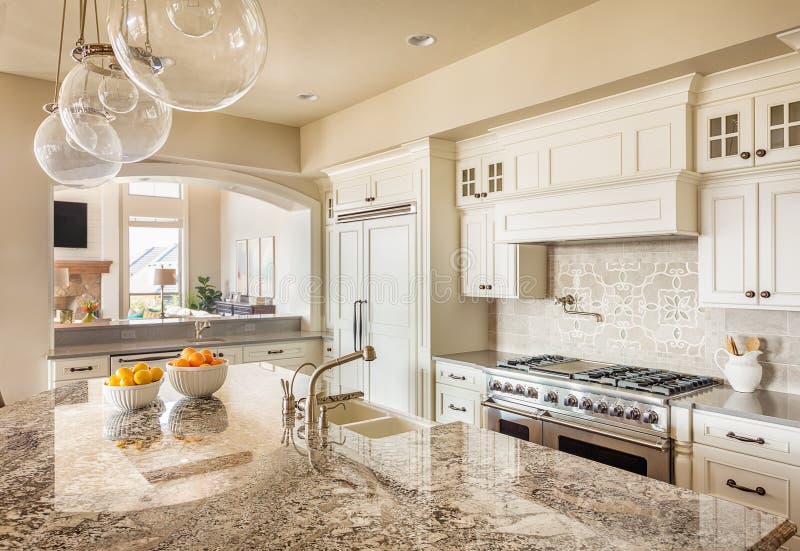 Kitchen with Island, Sink, Cabinets, and Hardwood Floors. Kitchen with Island, Sink, Cabinets, and Hardwood Floors