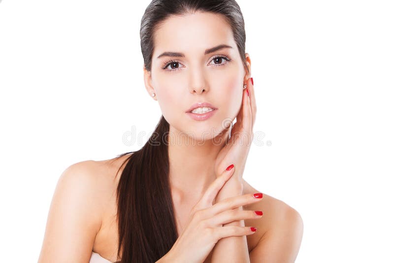 Belle femme de station thermale touchant son visage parfait images libres de droits Belle femme de station thermale touchant son visage parfait images libres de droits