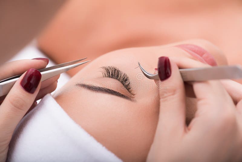 My favorite procedure. Close up of eyelash extension procedure in beauty salon for attractive woman. My favorite procedure. Close up of eyelash extension procedure in beauty salon for attractive woman