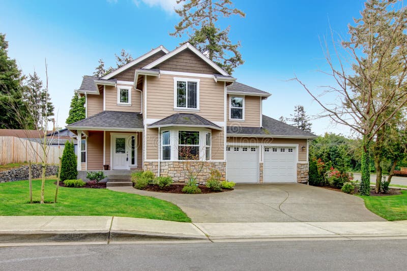 Siding house with tile roof, enclosed garage, and beautiful curb appeal. Siding house with tile roof, enclosed garage, and beautiful curb appeal