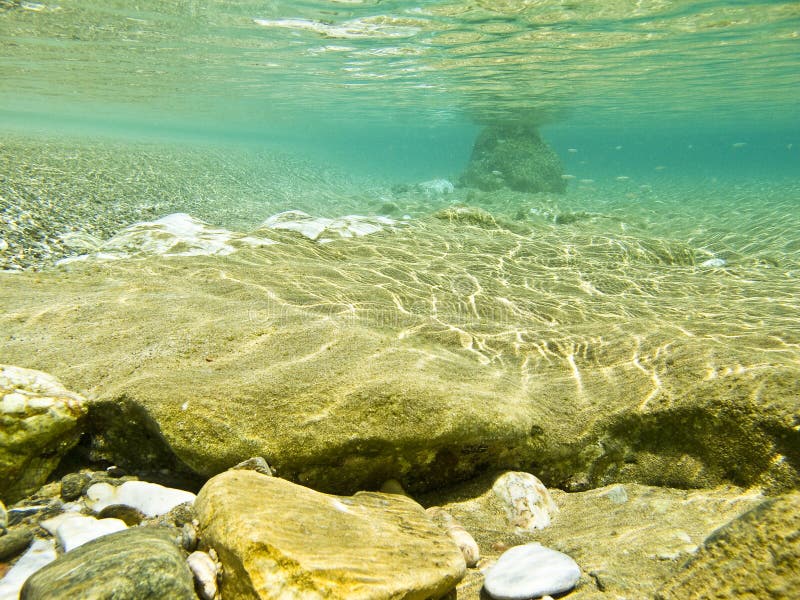 Rocks and pebbles in a very pure underwater scene. Rocks and pebbles in a very pure underwater scene