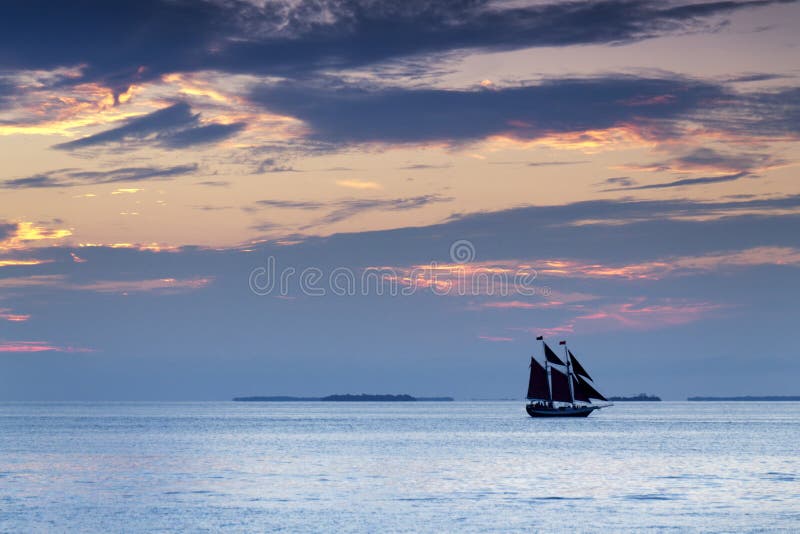 These sail boats take quiet advantage of the beautiful sunsets in Key West Florida. Even after the sun has set below the horizon, the colors in the sky and ocean abound. These sail boats take quiet advantage of the beautiful sunsets in Key West Florida. Even after the sun has set below the horizon, the colors in the sky and ocean abound.