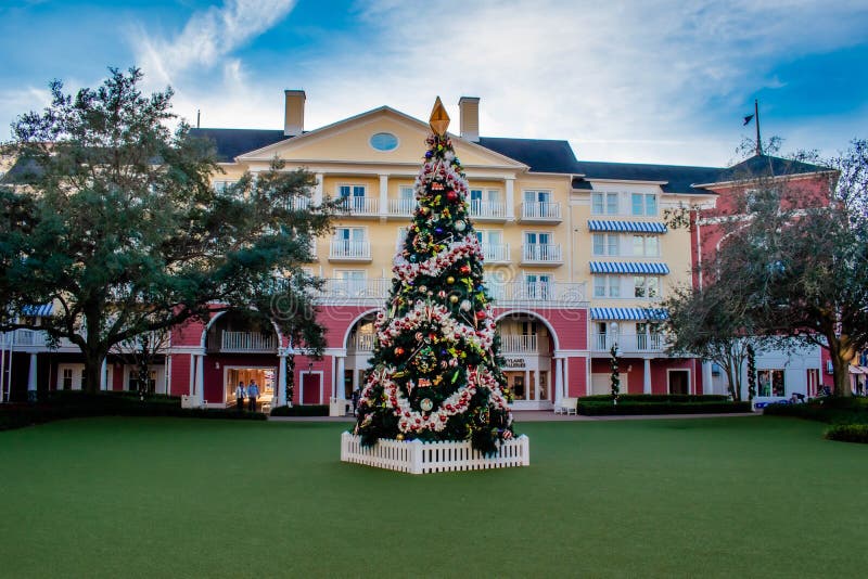 Orlando, Florida. December 18. 2019. Beautiful view of Christmas Tree on colorful building background at Lake Buena Vista 1. Orlando, Florida. December 18. 2019. Beautiful view of Christmas Tree on colorful building background at Lake Buena Vista 1