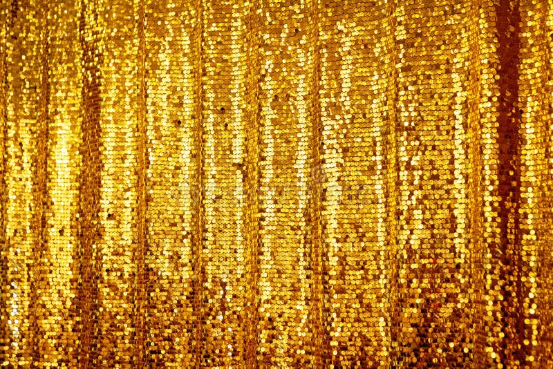 Beautiful golden glitter background. Empty Texture. Holiday background with golden sequins, copyspace, hanging curtain. Sparkling sequined textile. Beautiful golden glitter background. Empty Texture. Holiday background with golden sequins, copyspace, hanging curtain. Sparkling sequined textile
