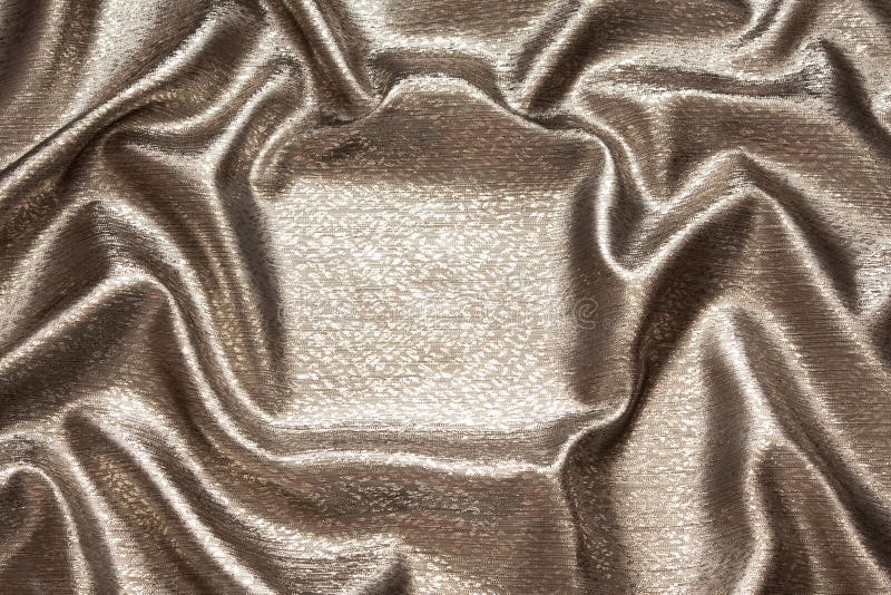 Beautiful brilliant silk wavy bronze and gold fabric. Beautiful brilliant silk wavy bronze and gold fabric