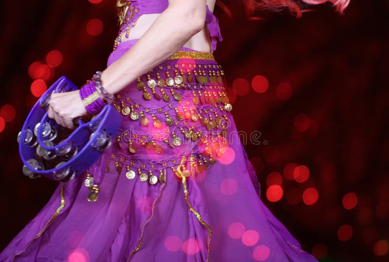 Belly Dancer Wearing A Purple Coin Belt And Workout Clothing Stock Photo -  Download Image Now - iStock