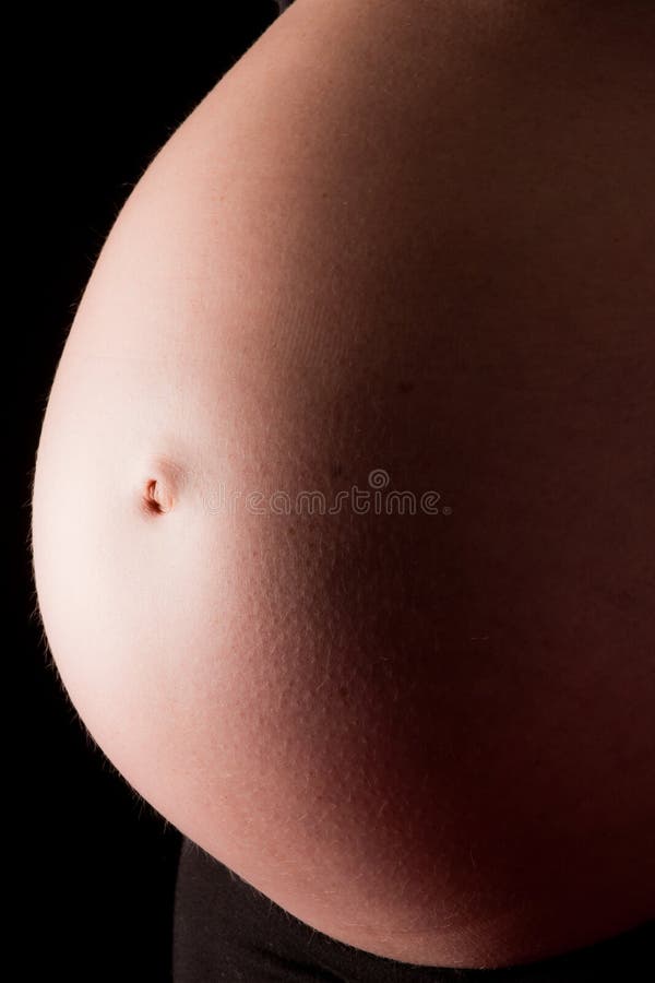 Belly of a pregnant female stock photo. Image of birth - 12757700