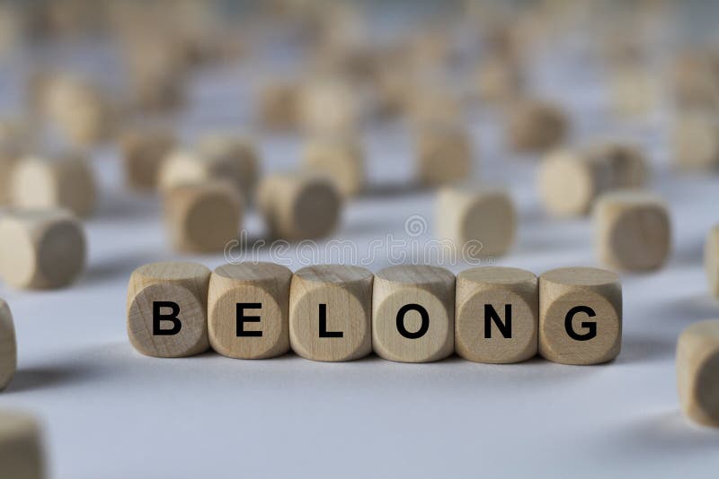 Belong - cube with letters, sign with wooden cubes