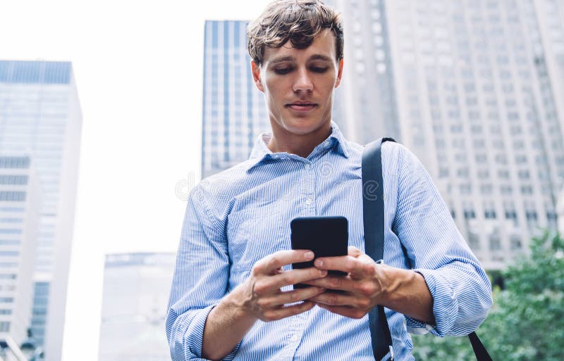 Below View of Employer Reading Sms on Modern Mobile Phone while Standing at  Urban Setting Stock Image - Image of mobile, male: 295189377