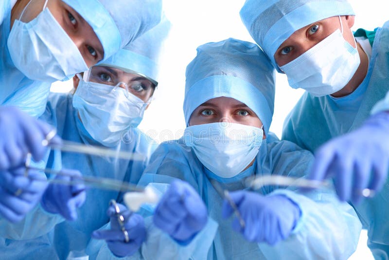 Below View of Surgeons Holding Medical Instruments in Hands Stock Image