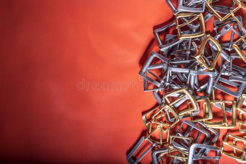 Belt Buckles and Coral Leather Background with Empty Space for Mockup