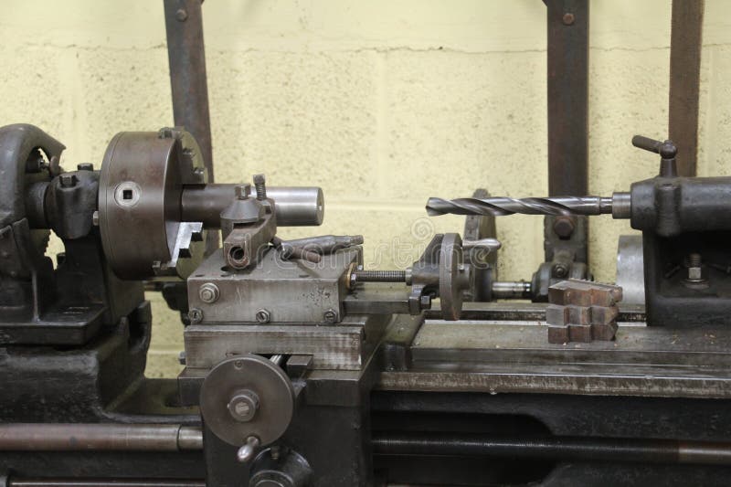 Old belt driven lathe used to turn metal. These machines were common in the earlier part of the twentyth century.