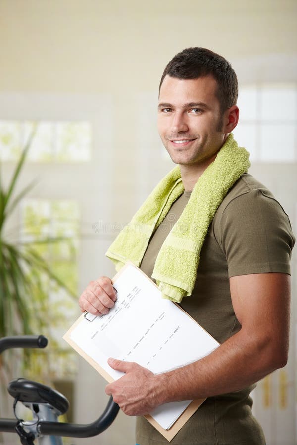 Bemannen Sie Holdingtrainingsplan lizenzfreies stockbild Bemannen Sie Holdingtrainingsplan lizenzfreies stockbild