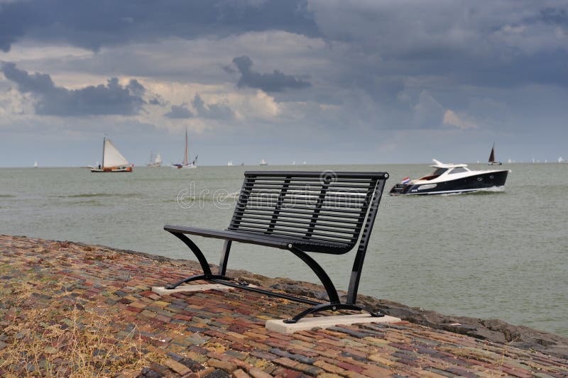 A bench and the boat in the Netherlands