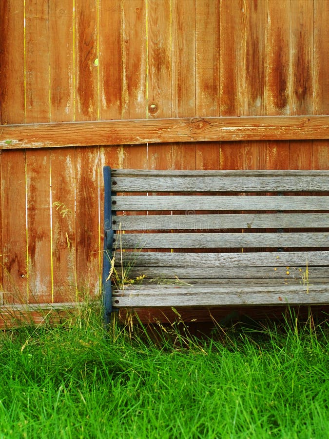 Bench faded fence grass wooden στοκ φωτογραφίες