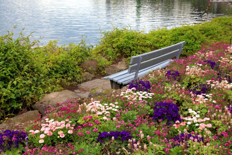 Bench and flowers at alpen lake in Montreux (Switzerland)