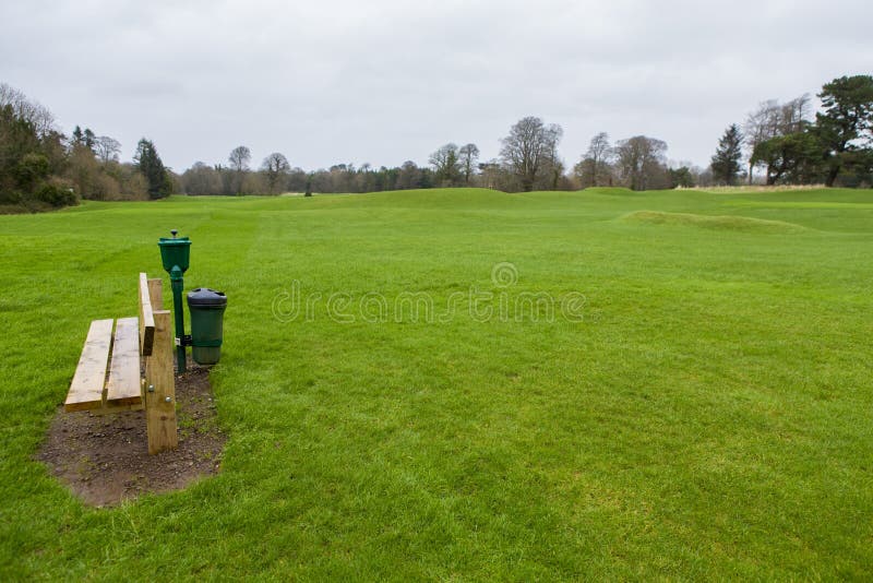 Bench on a golf course stock image. Image of beautiful 116060031