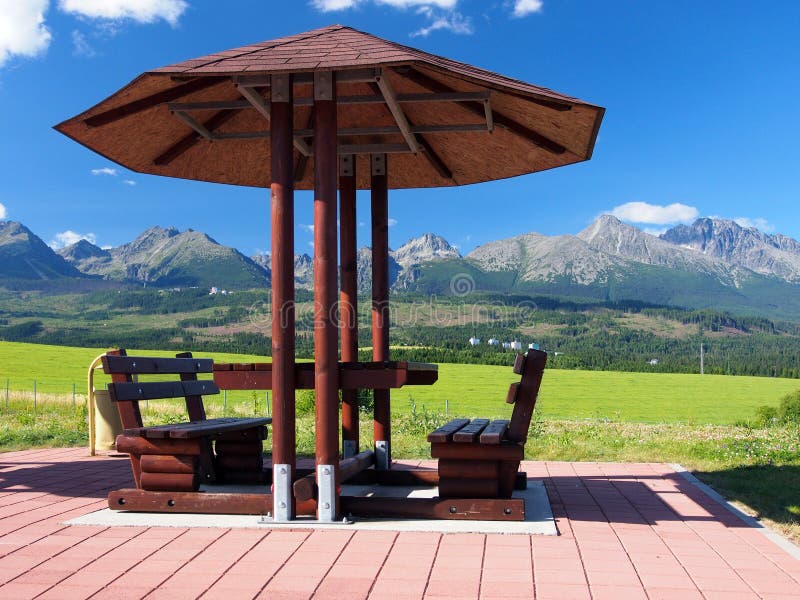 Benches under shelter and High Tatras