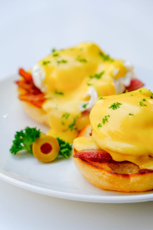 Benedict eggs on a white background with onion and olives royalty free stock photo Benedict eggs on a white background with onion and olives royalty free stock photo